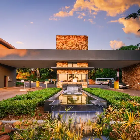 Stone water feature at an estate entrance.