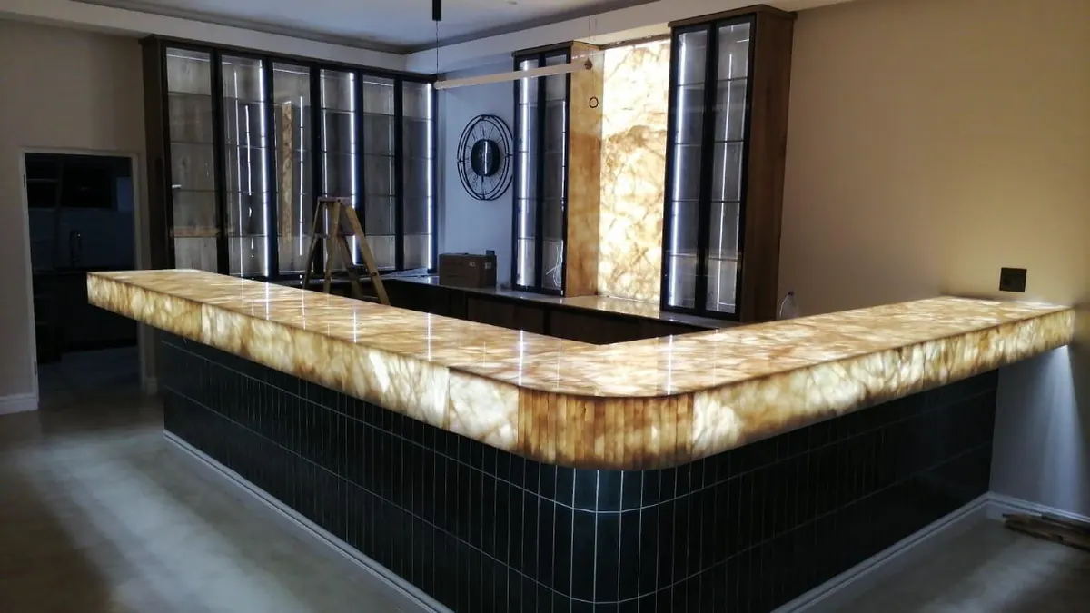 L-shaped illuminated bar and matching wall panel.