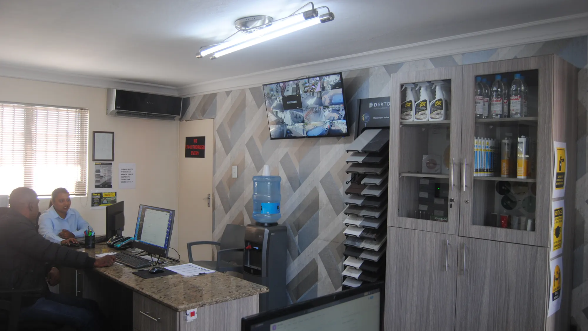 Office desk, sample rack and storage cabinet.