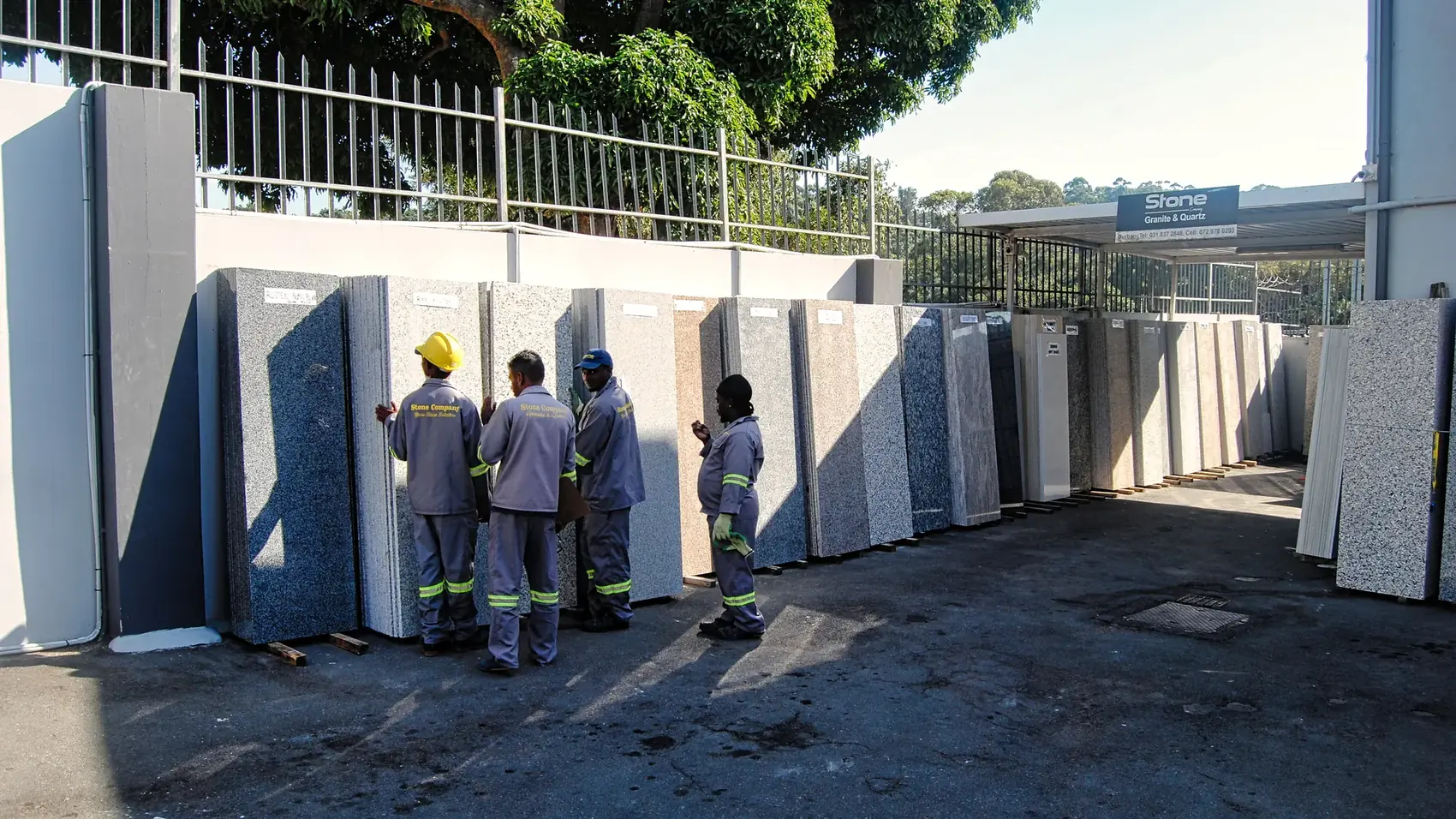 Upright stone slabs in an outdoor yard.