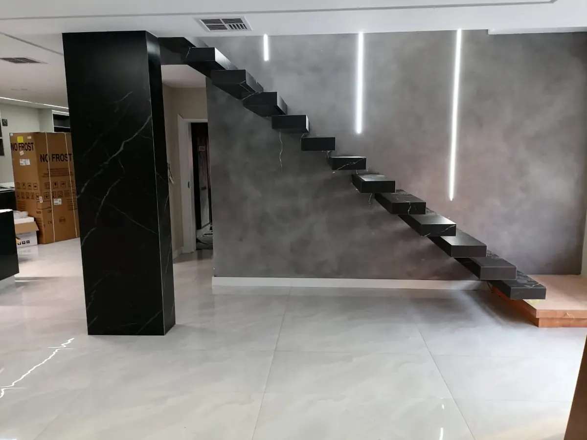 Stone staircase and wall surface in completed interior.